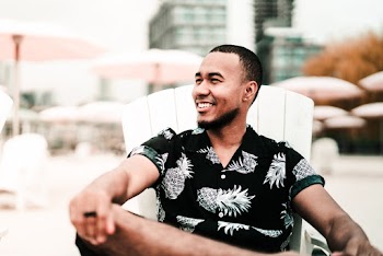 Photo of Man Sitting On Beach Chair