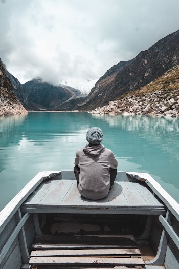 Photo Of Man Sitting On Boat