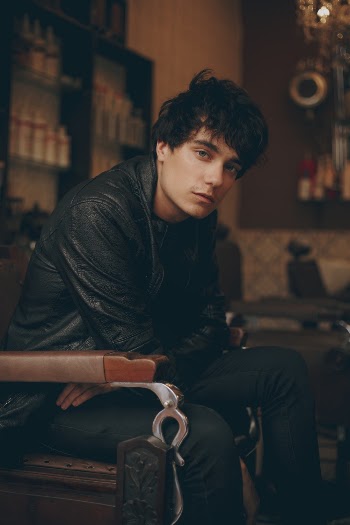 Photo of Man Sitting on Chair