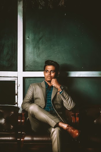 Photo Of Man Sitting On Chair