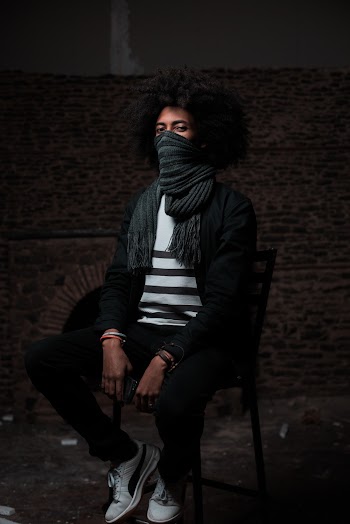 Photo Of Man Sitting On Chair