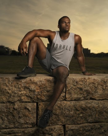 Photo of Man Sitting on Concrete Blocks