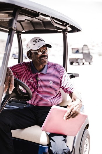 Photo of Man Sitting on Golf Cart