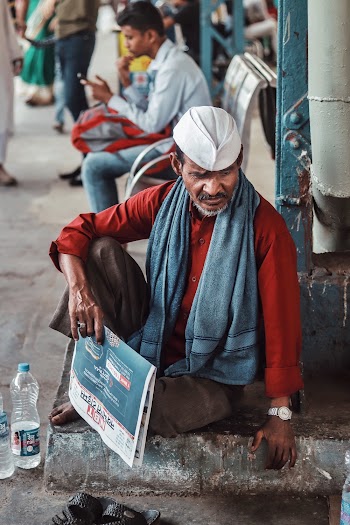 Photo Of Man Sitting On Pavement