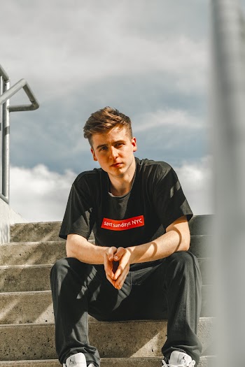 Photo Of Man Sitting On Staircase