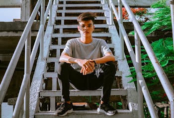 Photo of Man Sitting on Stairs