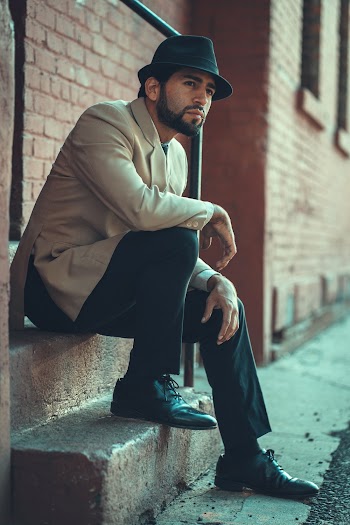 Photo of Man Sitting on Stairway