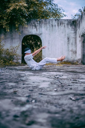 Photo Of Man Sitting On The Ground