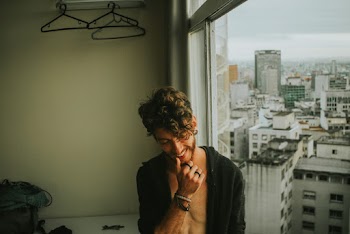 Photo of Man Smiling and Wearing Jacket