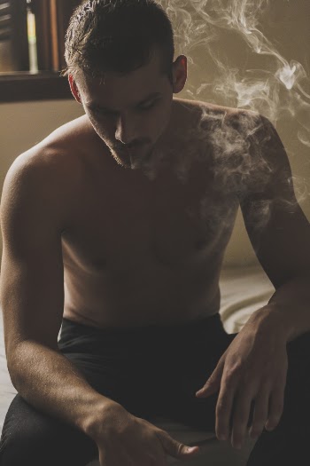 Photo of Man Smoking Cigarette