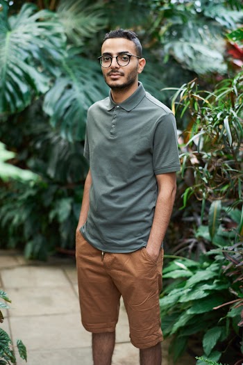 Photo Of Man Standing Beside Plants