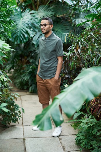 Photo Of Man Standing Beside Plants