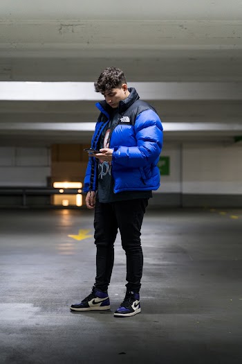 Photo of Man Standing in Car Park