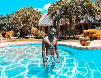 Photo of Man Standing in Pool