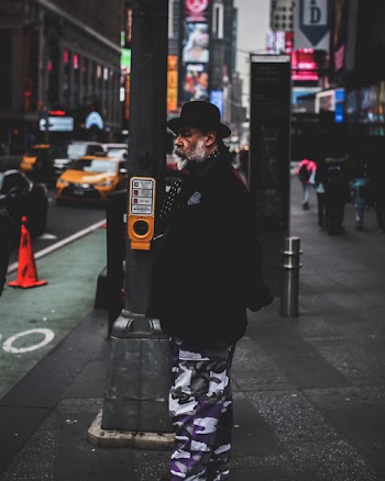 Photo of Man Standing in the Street