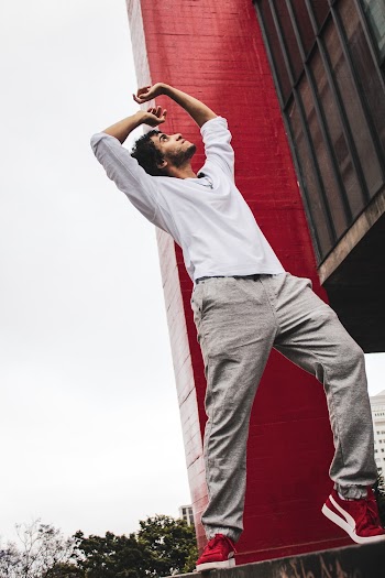 Photo Of Man Standing Near Building