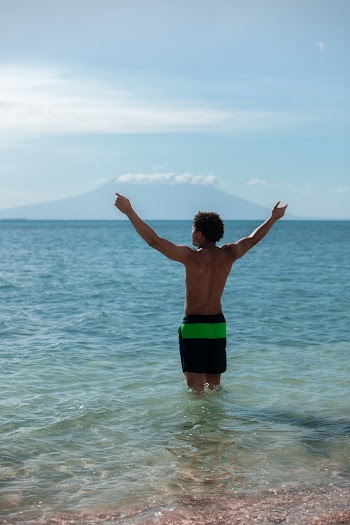 Photo of Man Standing on Beach
