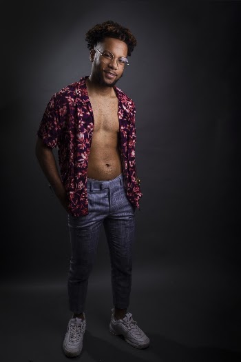 Photo of Man Standing on Black Background
