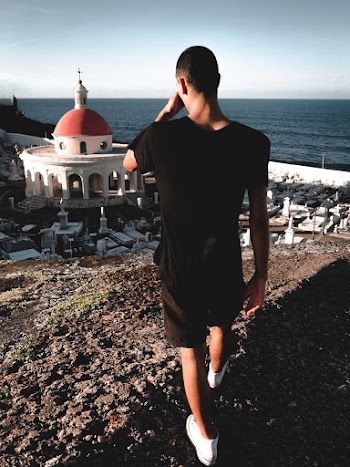 Photo of Man Standing on Hill