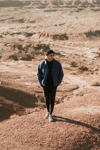 Photo of Man Standing on Sand