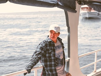 Photo Of Man Standing On Ship