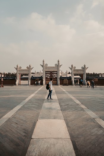 Photo of Man Standing While Wearing Backpack