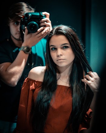 Photo Of Man Taking Photo Of Woman