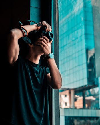 Photo of Man Taking Picture