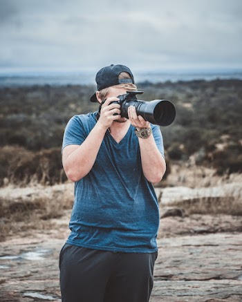 Photo of Man Taking Picture
