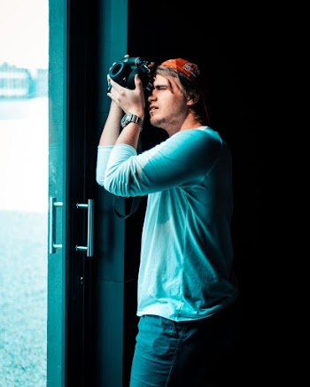 Photo Of Man Taking Pictures