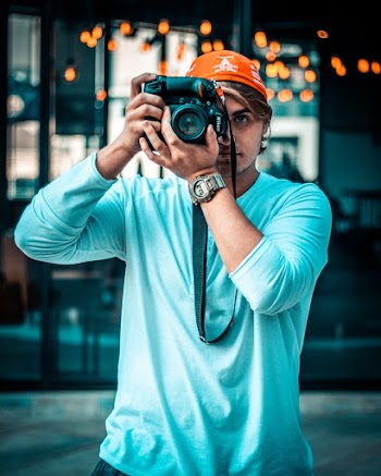 Photo Of Man Taking Pictures