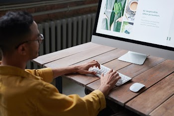 Photo Of Man Using Computer