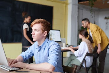 Photo Of Man Using Computer