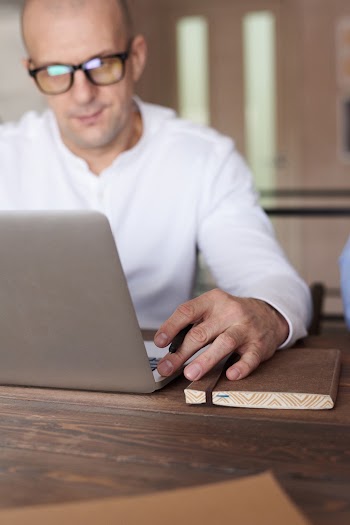 Photo Of Man Using Laptop