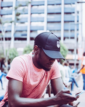 Photo of Man Using Mobile Phone