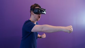 Photo Of Man Using Virtual Reality Headset