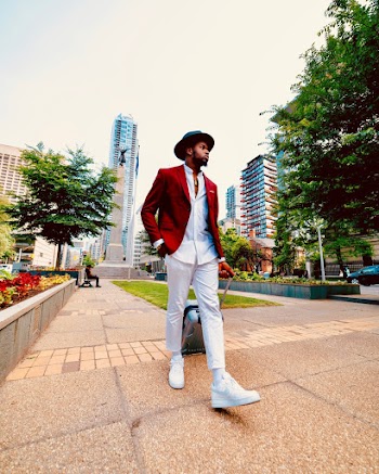Photo of Man Walking on Pavement