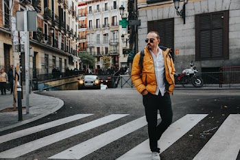 Photo of Man Walking on Pedestrian Crossing