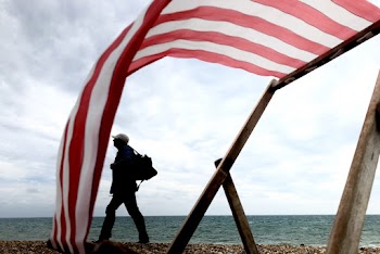 Photo Of Man Walking On Seaside