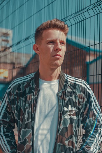 Photo Of Man Wearing Adidas Jacket