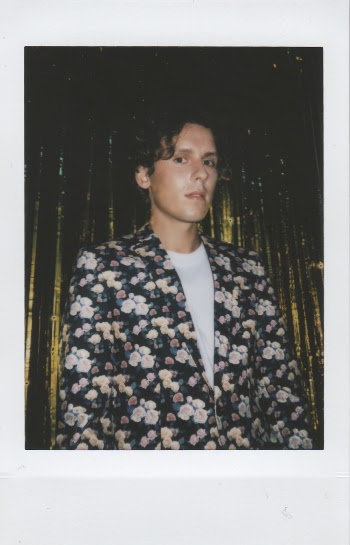 Photo of Man Wearing Black and White Floral Suit Jacket