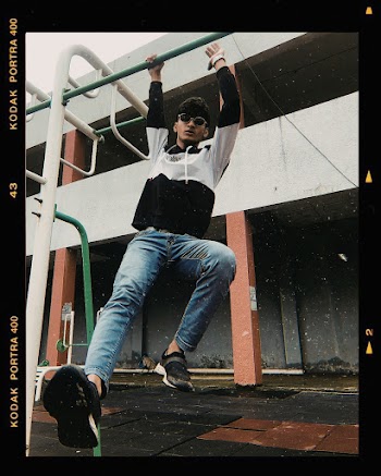 Photo Of Man Wearing Black And White Hoodie