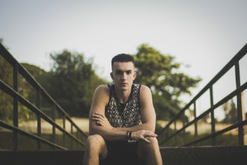 Photo of Man Wearing Black And White Tank Top