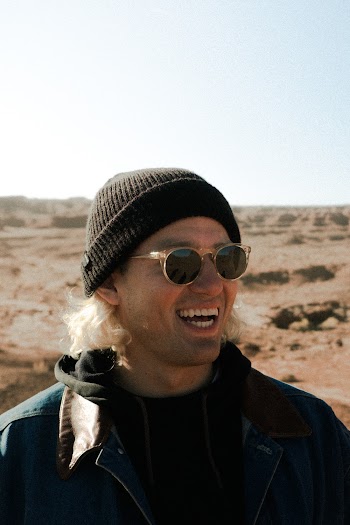 Photo of Man Wearing Black Beanie and Sunglasses