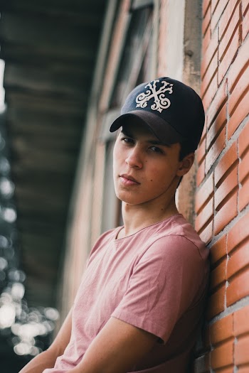 Photo of Man Wearing Black Cap