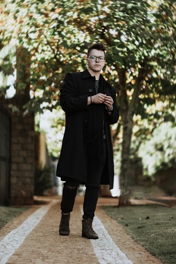 Photo of Man Wearing Black Coat