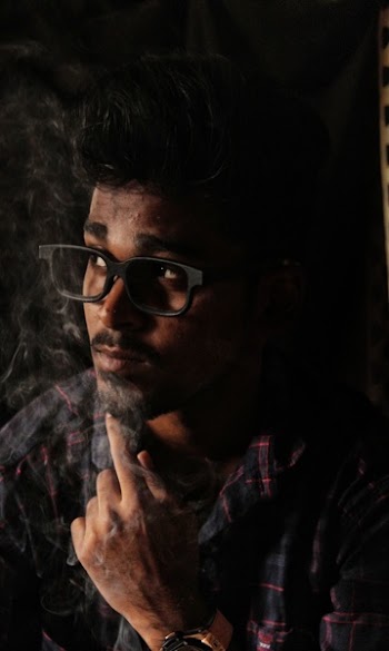 Photo of Man Wearing Black Frame Glasses