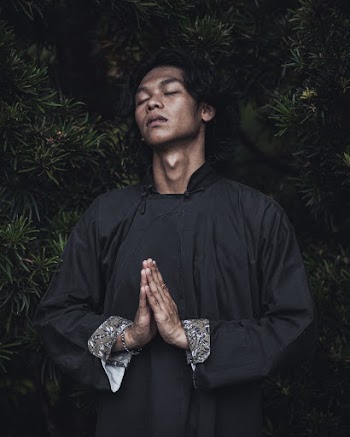 Photo of Man Wearing Black Long-Sleeved Top
