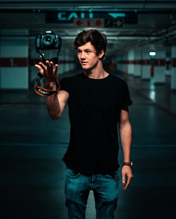 Photo of Man Wearing Black Shirt