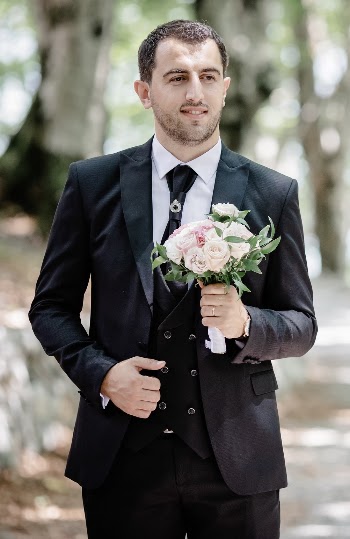 Photo Of Man Wearing Black Suit